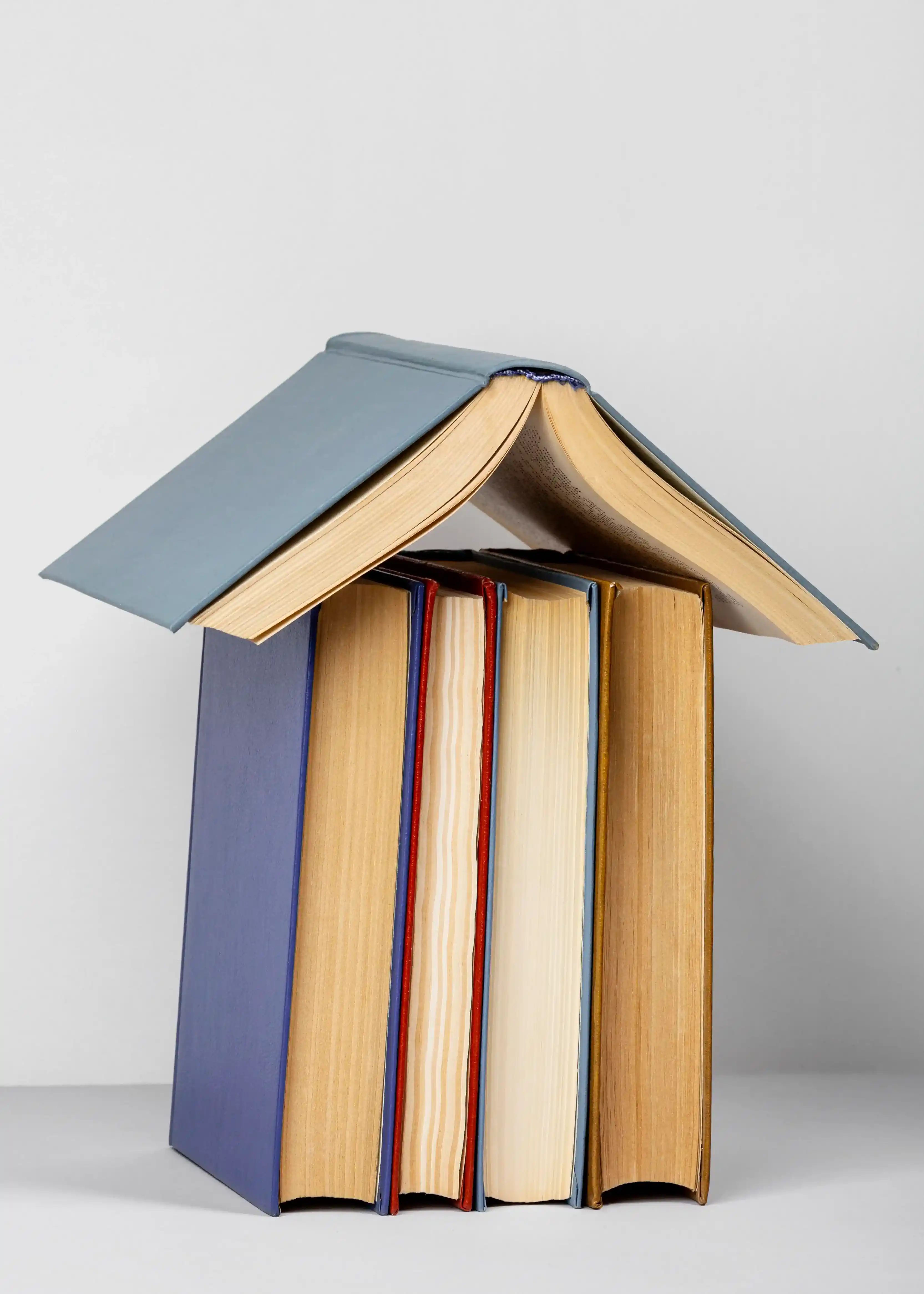 Unusually stacked books.